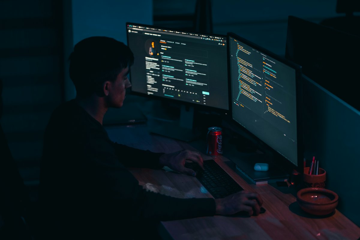 Developer working at two monitors